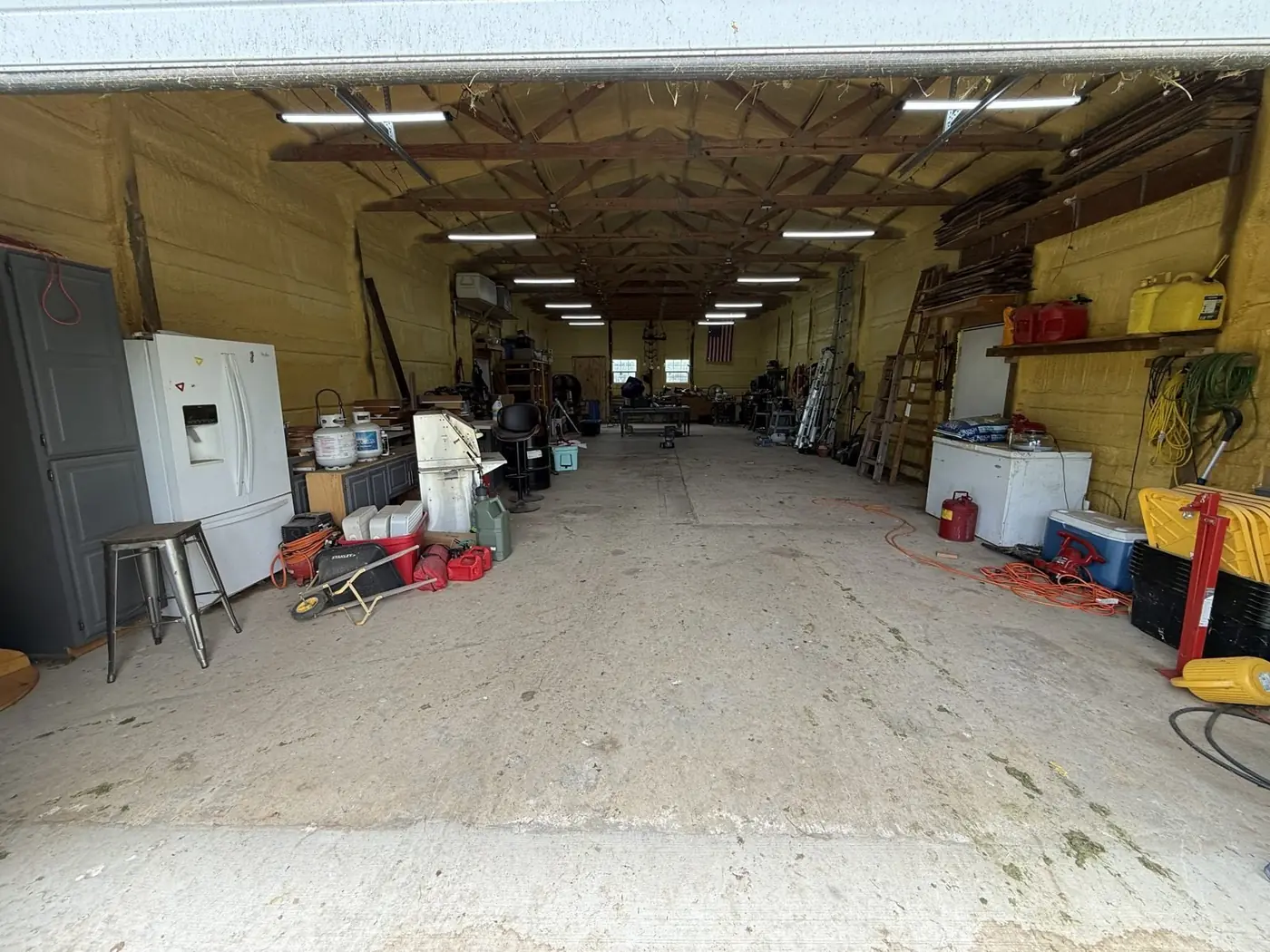 Inside the farm shop, with tools and woodworking benches.